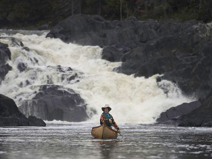 Alexandra Conover paddling Wildcat on the Allagash River