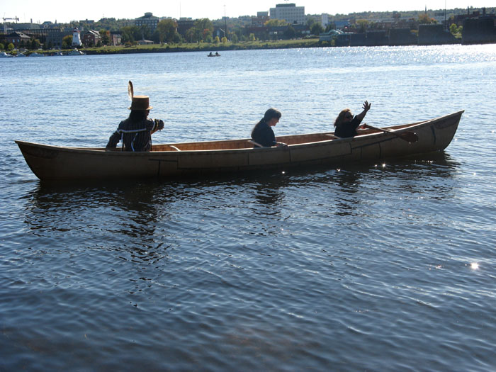The grandmother canoe, paddled by Wayne and Kim Brooks, with Andrea Bear Nicholas riding amidships