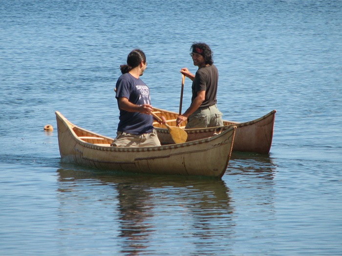Canoes on the bay by Jon Clark
