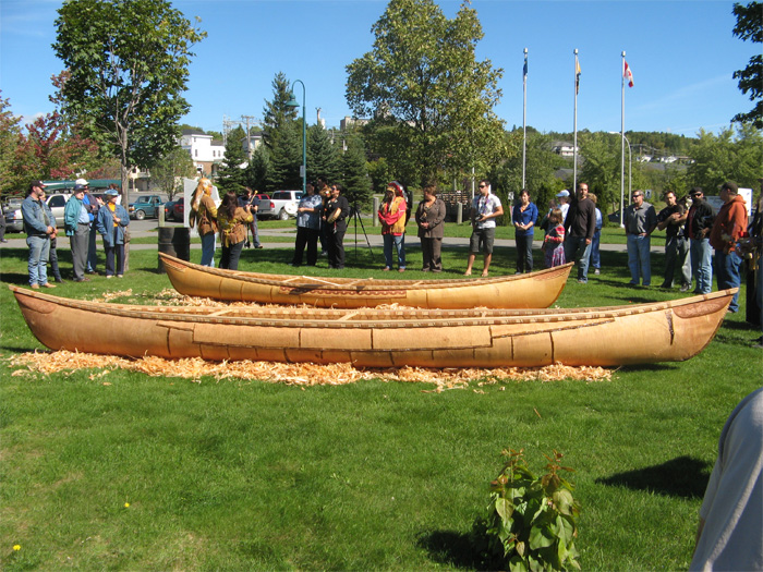 The 19-foot canoe in back, the Grandmother in front